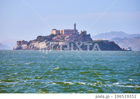 Choppy San Francisco Bay waters with full view of Alcatraz Island and docked boat Choppy San Francisco Bay waters with full view of Alcatraz Island and docked boat 106529352