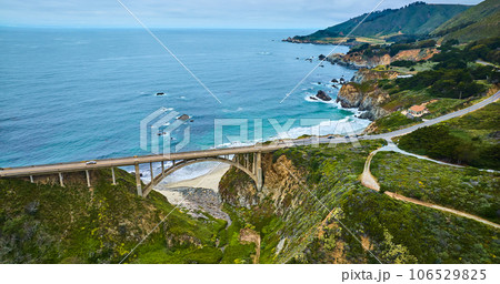 Aerial scenic side view of Highway One Rocky Creek Bridge with ocean and coast view Aerial scenic side view of Highway One Rocky Creek Bridge with ocean and coast view 106529825