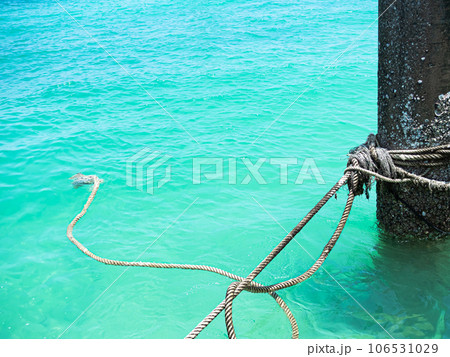 Pole Mooring in Sea Background, Rope Security Safety Boat on Grunge Metal Iron Steel Rust Concrete Corrosion Craft, Coast Blue Ocean Harbour Ship Dock Bollard on Water, Travel Transportation Port. Pole Mooring in Sea Background, Rope Security Safety Boat on Grunge Metal Iron Steel Rust Concrete Corrosion Craft, Coast Blue Ocean Harbour Ship Dock Bollard on Water, Travel Transportation Port. 106531029