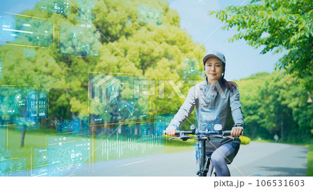 ヘルスケアテクノロジー　自転車に乗る女性とデータ 106531603