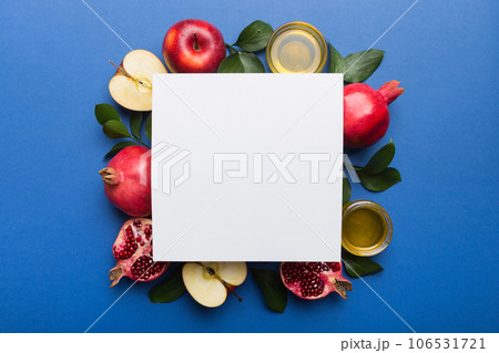 Flat lay composition with Blank flyer poster and symbols jewish Rosh Hashanah holiday attributes on colored background, New Year holiday Traditional. Top view with copy space mock up Flat lay composition with Blank flyer poster and symbols jewish Rosh Hashanah holiday attributes on colored background, New Year holiday Traditional. Top view with copy space mock up 106531721