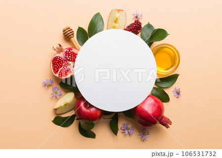 Flat lay composition with Blank flyer poster and symbols jewish Rosh Hashanah holiday attributes on colored background, New Year holiday Traditional. Top view with copy space mock up 106531732