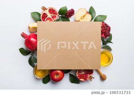 Flat lay composition with Blank flyer poster and symbols jewish Rosh Hashanah holiday attributes on colored background, New Year holiday Traditional. Top view with copy space mock up Flat lay composition with Blank flyer poster and symbols jewish Rosh Hashanah holiday attributes on colored background, New Year holiday Traditional. Top view with copy space mock up 106531733