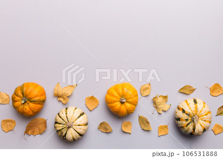 Autumn composition. Pattern made of dried leaves and other design accessories on table. Flat lay, top view 106531888