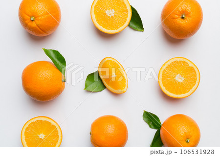Fruit pattern of fresh orange slices on colored background. Top view. Copy Space. creative summer concept. Half of citrus in minimal flat lay 106531928