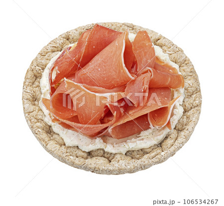 Puffed rice cake with cream cheese and smoked ham isolated on white background, top view Puffed rice cake with cream cheese and smoked ham isolated on white background, top view 106534267