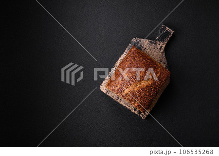 Delicious fresh crispy brown bread with grains and seeds Delicious fresh crispy brown bread with grains and seeds 106535268