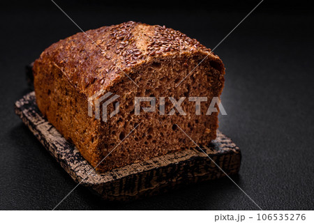 Delicious fresh crispy brown bread with grains and seeds 106535276