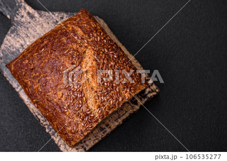 Delicious fresh crispy brown bread with grains and seeds Delicious fresh crispy brown bread with grains and seeds 106535277