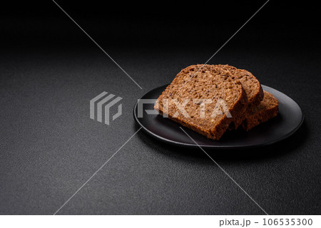 Delicious fresh crispy brown bread with grains and seeds 106535300