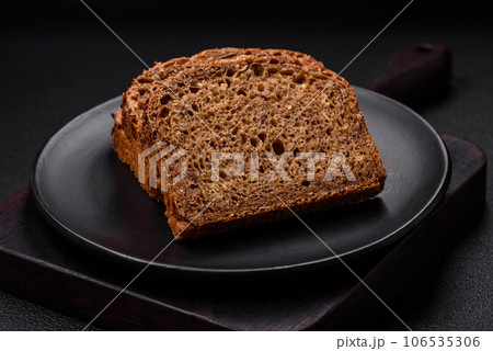 Delicious fresh crispy brown bread with grains and seeds Delicious fresh crispy brown bread with grains and seeds 106535306