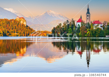 Bled, Slovenia - Sunrise with Julian Alps and Church Santa Maria, beautiful Europe. Bled, Slovenia - Sunrise with Julian Alps and Church Santa Maria, beautiful Europe. 106540744