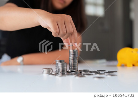 Business women put coin stack money and many bank note in office, Save money for future and Retirement 106541732