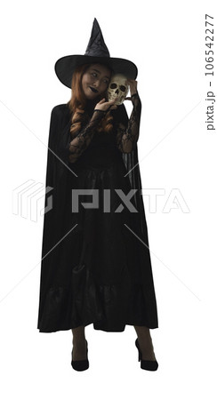 Halloween witch holding a skull Halloween witch holding a skull 106542277