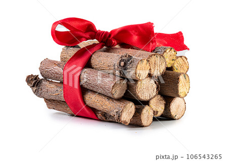 firewood logging. pile of firewood isolated. timber storage of prepared firewood, a bunch of logs, hardwood; Sawed firewood in forest logs close up with red ribbon 106543265