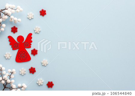 Christmas angel with white and red snowflakes 106544840