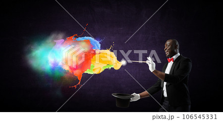 Male illusionist performing tricks . Mixed media 106545331