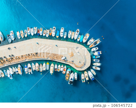Aerial view of boats and yachts in dock at sunset in summer 106545722