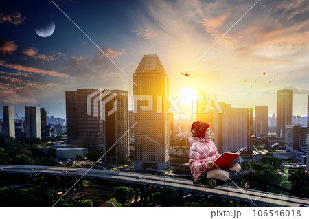 Little girl reading a book 106546018