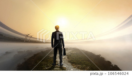 Businessman standing in front of landscape Businessman standing in front of landscape 106546024