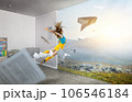 Young woman jumping in the air 106546184