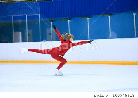 Talented, hardworking and concentrated girl, figure skating athlete in motions, training on ice rink arena 106546318