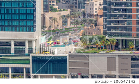 Walking promenade along water canal in Business Bay district of Dubai aerial timelapse. 106547142