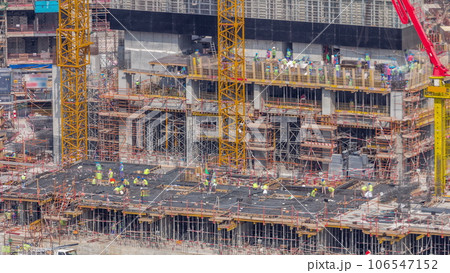 Large construction site with many working cranes timelapse. Large construction site with many working cranes timelapse. 106547152