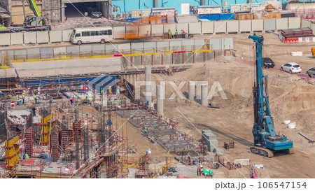 Large construction site with many working cranes timelapse. Large construction site with many working cranes timelapse. 106547154
