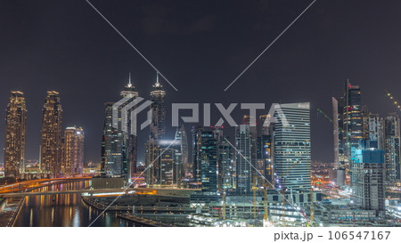 Cityscape with skyscrapers of Dubai Business Bay and water canal aerial night timelapse. Cityscape with skyscrapers of Dubai Business Bay and water canal aerial night timelapse. 106547167