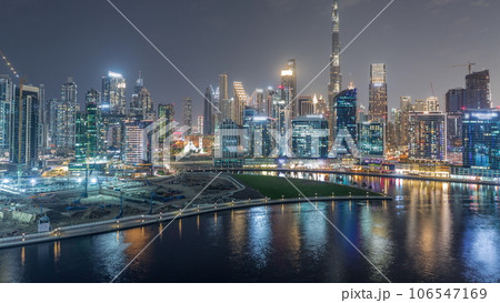 Aerial view to Dubai Business Bay and Downtown with the various skyscrapers and towers night timelapse 106547169