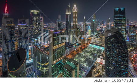 Skyline view of the high-rise buildings on Sheikh Zayed Road in Dubai aerial night timelapse, UAE. 106547231