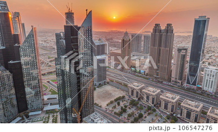 High-rise buildings on Sheikh Zayed Road in Dubai aerial timelapse during sunset, UAE. High-rise buildings on Sheikh Zayed Road in Dubai aerial timelapse during sunset, UAE. 106547276
