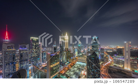 Skyline view of the high-rise buildings on Sheikh Zayed Road in Dubai aerial night timelapse, UAE. 106547289