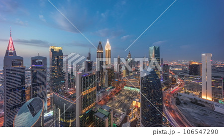 Skyline view of the high-rise buildings on Sheikh Zayed Road in Dubai aerial day to night timelapse, UAE. 106547290