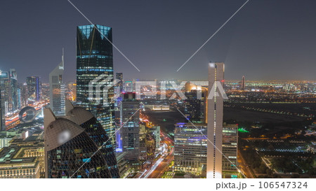 Skyline view of the high-rise buildings on Sheikh Zayed Road in Dubai aerial night timelapse, UAE. Skyline view of the high-rise buildings on Sheikh Zayed Road in Dubai aerial night timelapse, UAE. 106547324