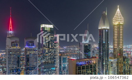 Skyline view of the high-rise buildings on Sheikh Zayed Road in Dubai aerial night timelapse, UAE. 106547362