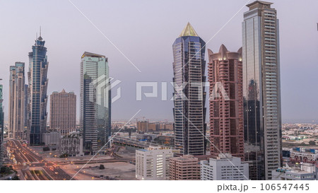 Business bay district skyline with modern architecture night to day timelapse from above. 106547445