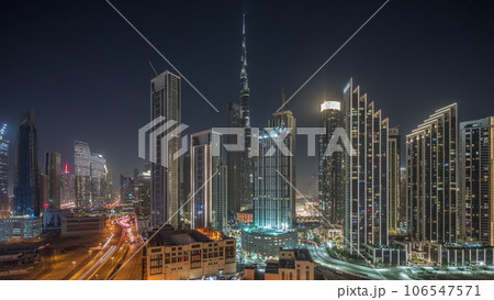 Aerial view of Dubai Downtown skyline with many towers night timelapse. Aerial view of Dubai Downtown skyline with many towers night timelapse. 106547571