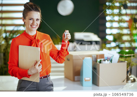 smiling 40 years old woman real estate agent in green office 106549736