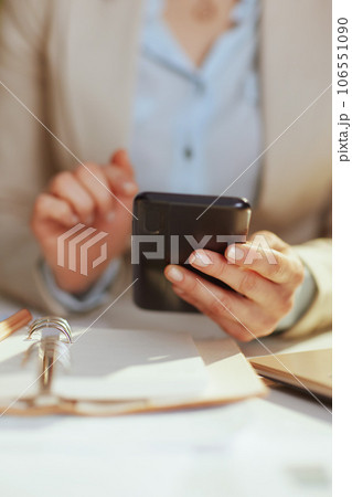 Modern bookkeeper woman in light business suit in green office Modern bookkeeper woman in light business suit in green office 106551090