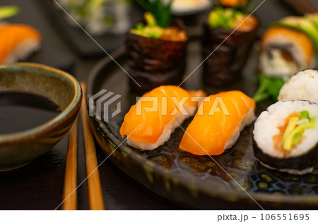 Luxurious and creative Sushi as Nigiri,Futomaki,Uramaki with chopsticks and Soja Luxurious and creative Sushi as Nigiri,Futomaki,Uramaki with chopsticks and Soja 106551695