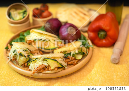 Traditional Arepas originating in Latin America, tasty stuffed corn dough Traditional Arepas originating in Latin America, tasty stuffed corn dough 106551858