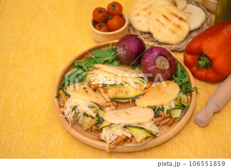 Traditional Arepas originating in Latin America, tasty stuffed corn dough 106551859