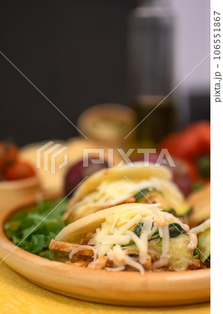 Traditional Arepas originating in Latin America, tasty stuffed corn dough 106551867