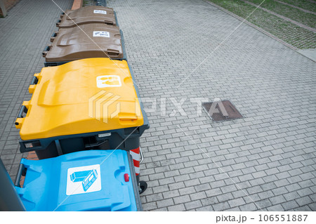 Recycling bins for plastic, cardboard and organic in their colors for public use 106551887