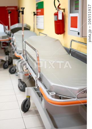 Paramedic Hospital bed or stretcher with blurred background of corridor on ground floor Paramedic Hospital bed or stretcher with blurred background of corridor on ground floor 106551917