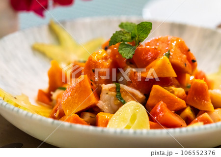 Ceviche with papaya is on the plate, close up photo Ceviche with papaya is on the plate, close up photo 106552376