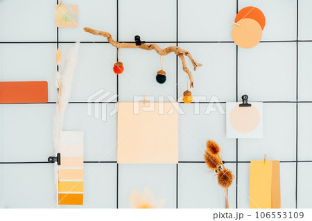 Close up grid mood board with fall colors palette notes and mockups, seasonal natural decor like dried flowers. Autumn inspiration and cozy hygge mood with copy space. Gradient of warm shades of fall 106553109