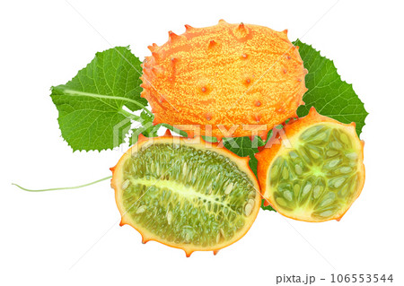 Kiwano or horned melon with leaves isolated on white background, Top view. Flat lay. Kiwano or horned melon with leaves isolated on white background, Top view. Flat lay. 106553544